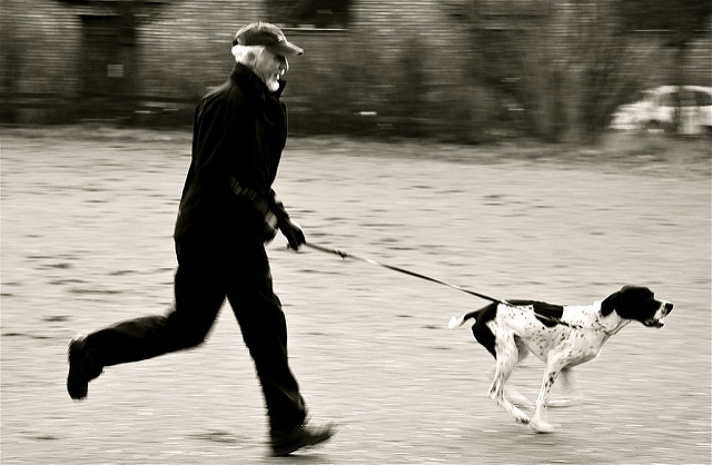 man running with his dog